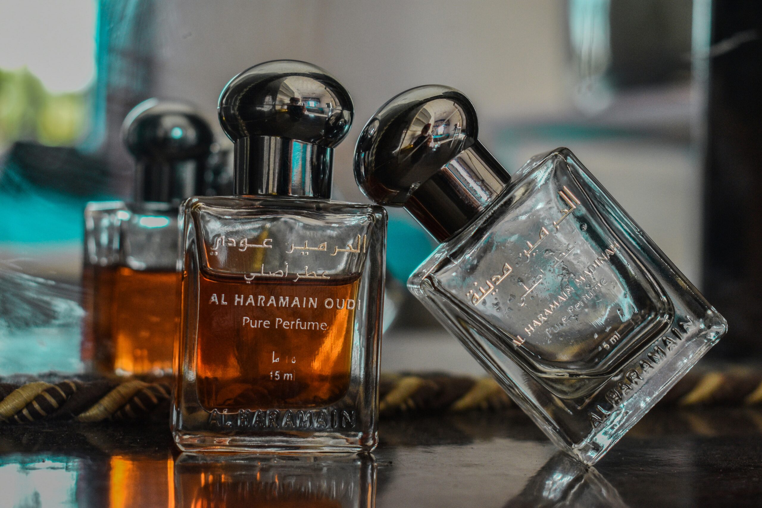 selective focus photography of clear glass perfume bottle